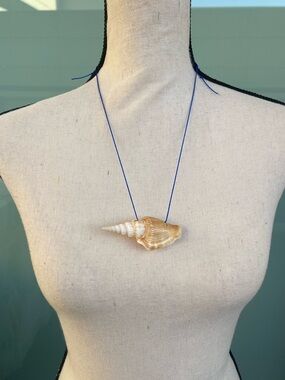 Handmade Spiral Seashell Necklace on a Blue Nylon Cord